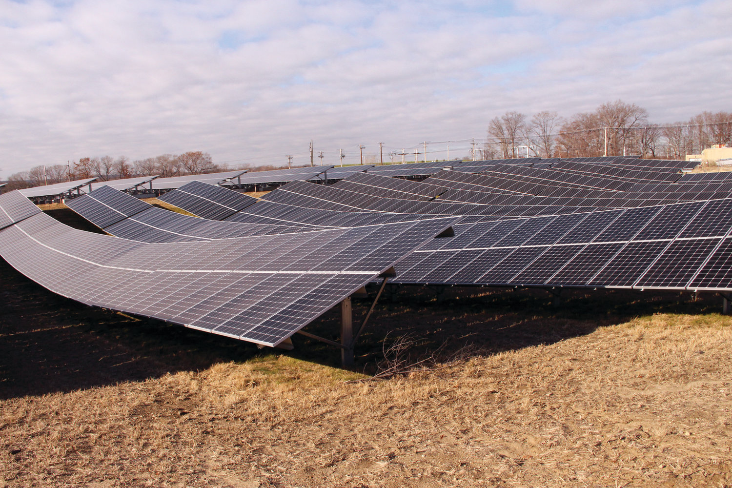 WHAT IT COULD BE: Southern Sky Renewal Energy built this solar farm on a brown field in Warwick. Some homeowners on Natick Avenue feel the company should be looking to develop similar sites in Cranston, not the wooded land under consideration.